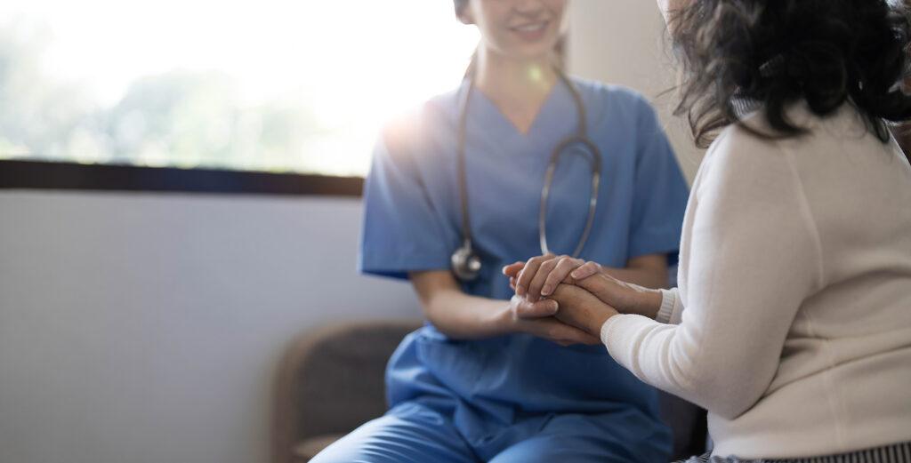 nurse holding hand